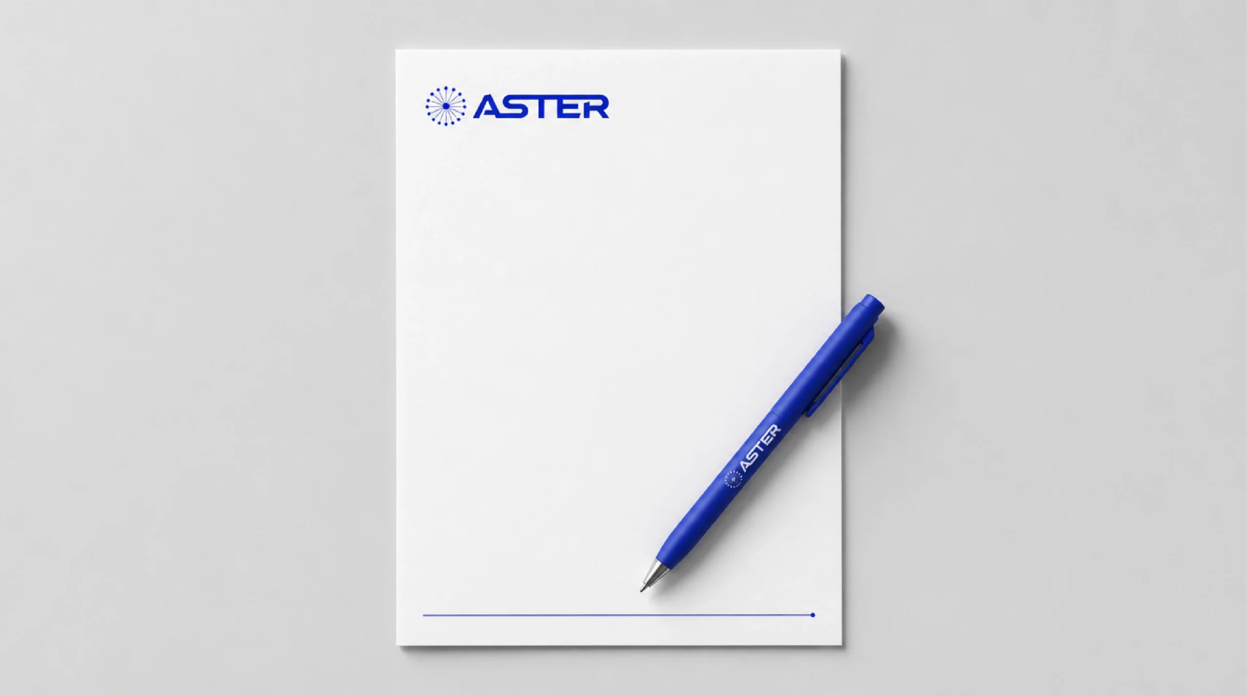 Aster letterhead and pen